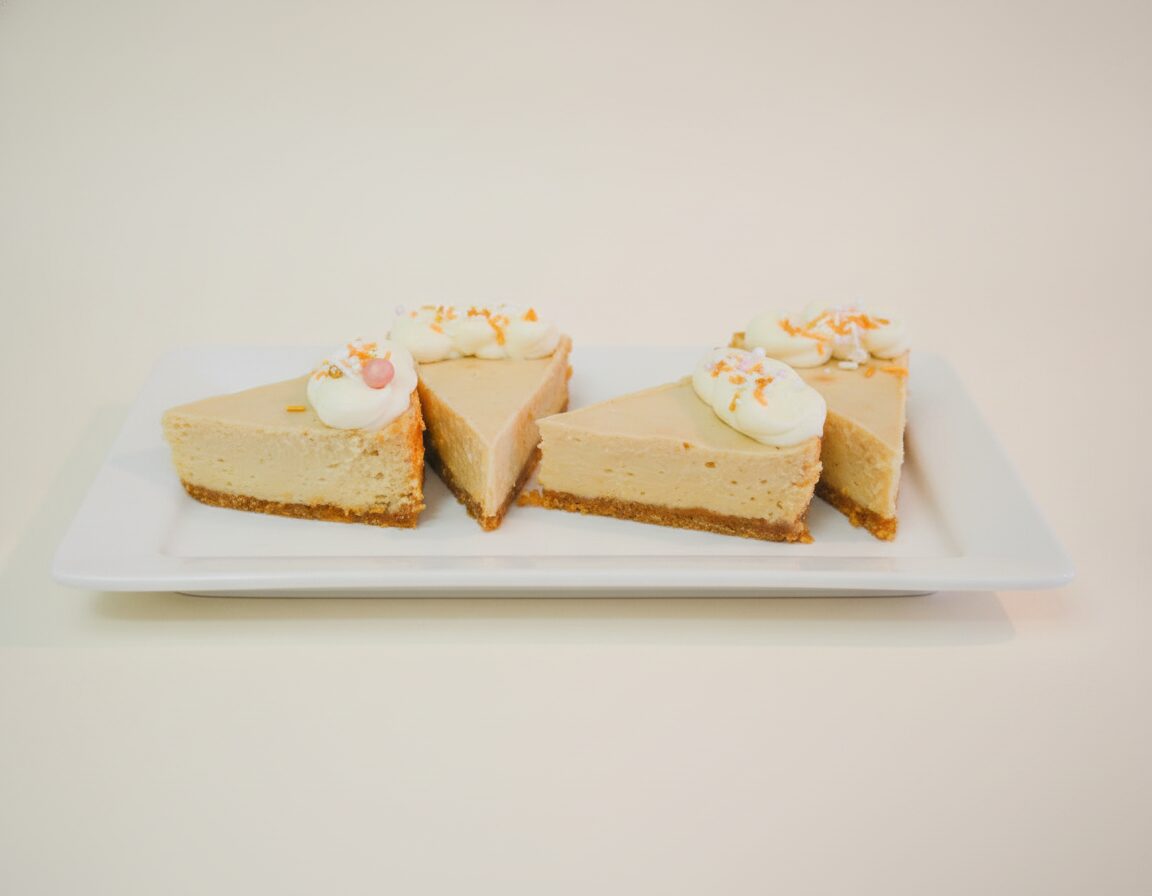 Slices of key lime pie on a white surface